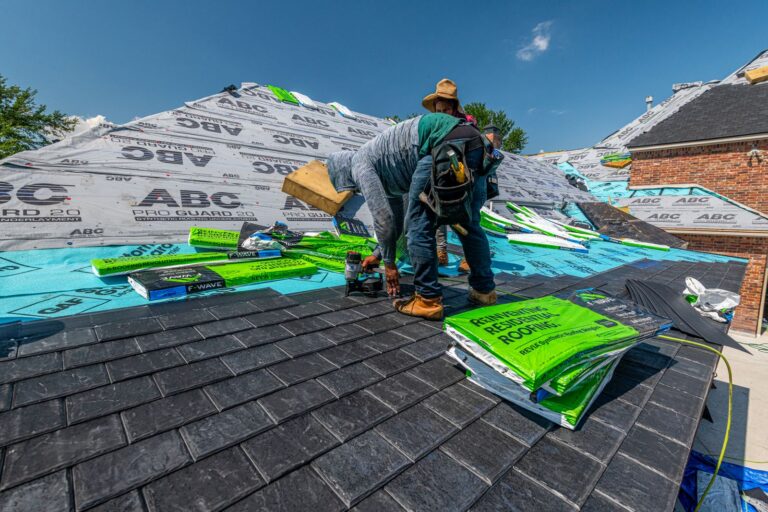 Roofers installing shingles, the kind of crew Florida workers' comp exemption rules apply to